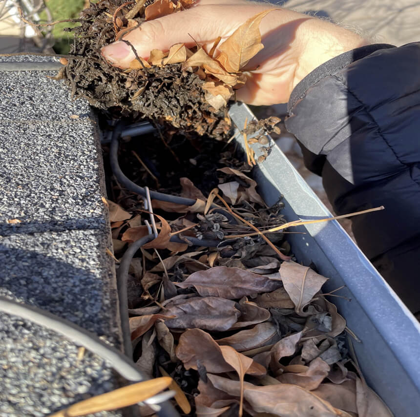 P2 Pressure Washing cleaning out gutters in Raleigh